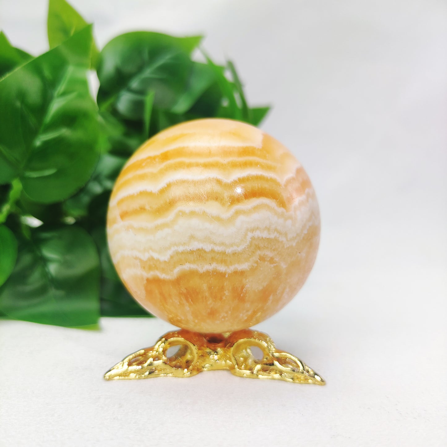 Yellow  Calcite Sphere with Raven Holder