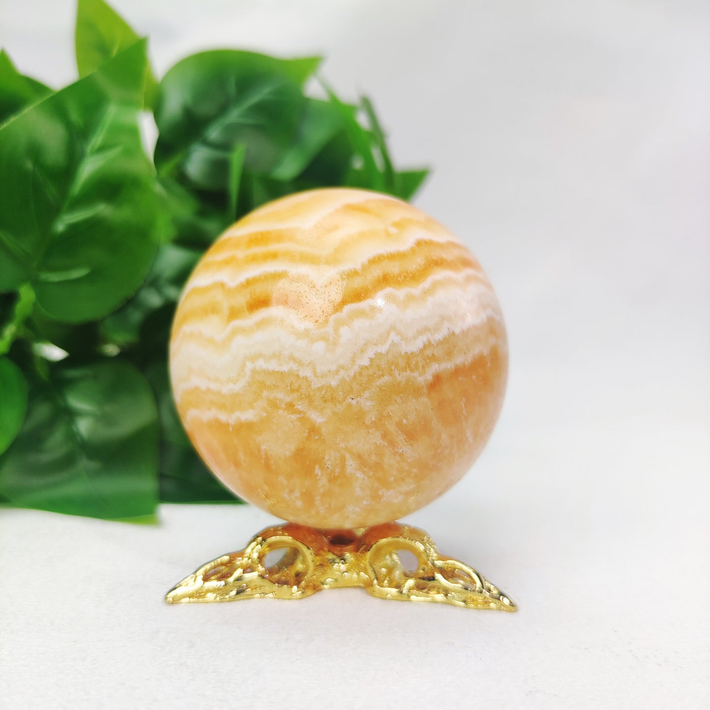 Yellow  Calcite Sphere with Raven Holder