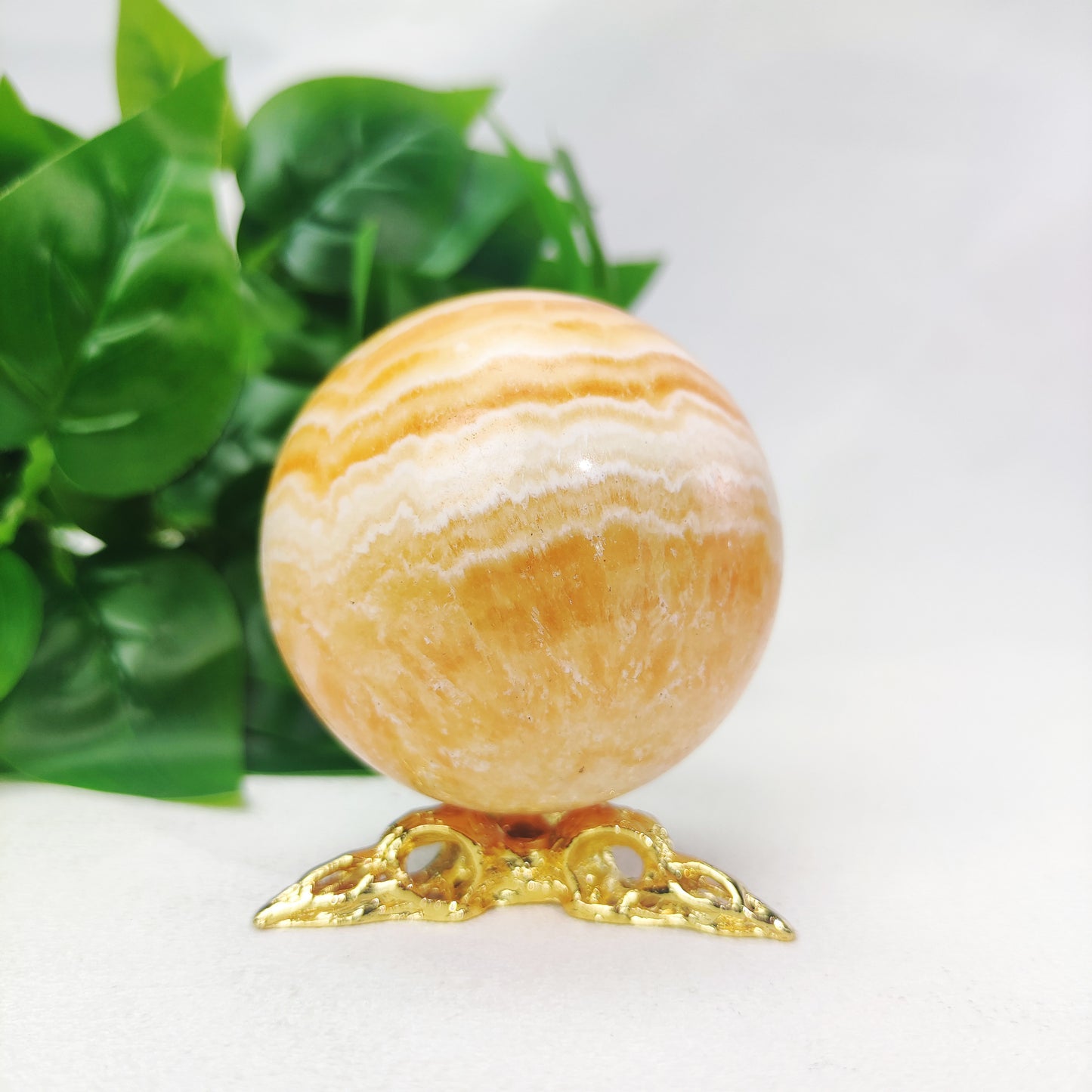 Yellow  Calcite Sphere with Raven Holder