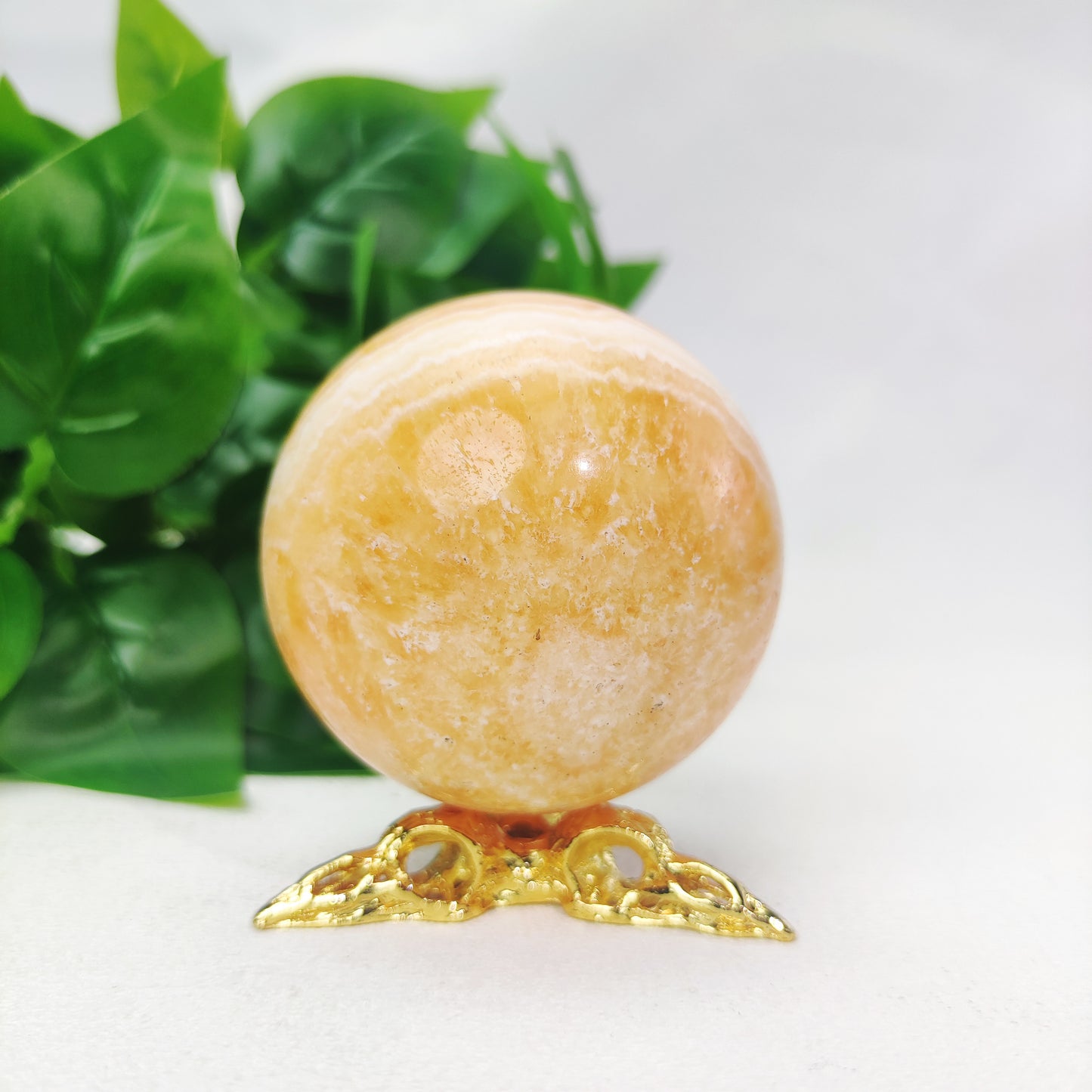 Yellow  Calcite Sphere with Raven Holder