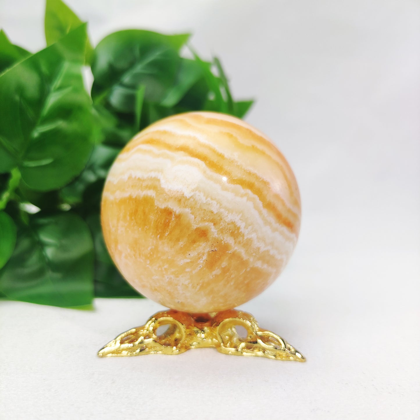 Yellow  Calcite Sphere with Raven Holder