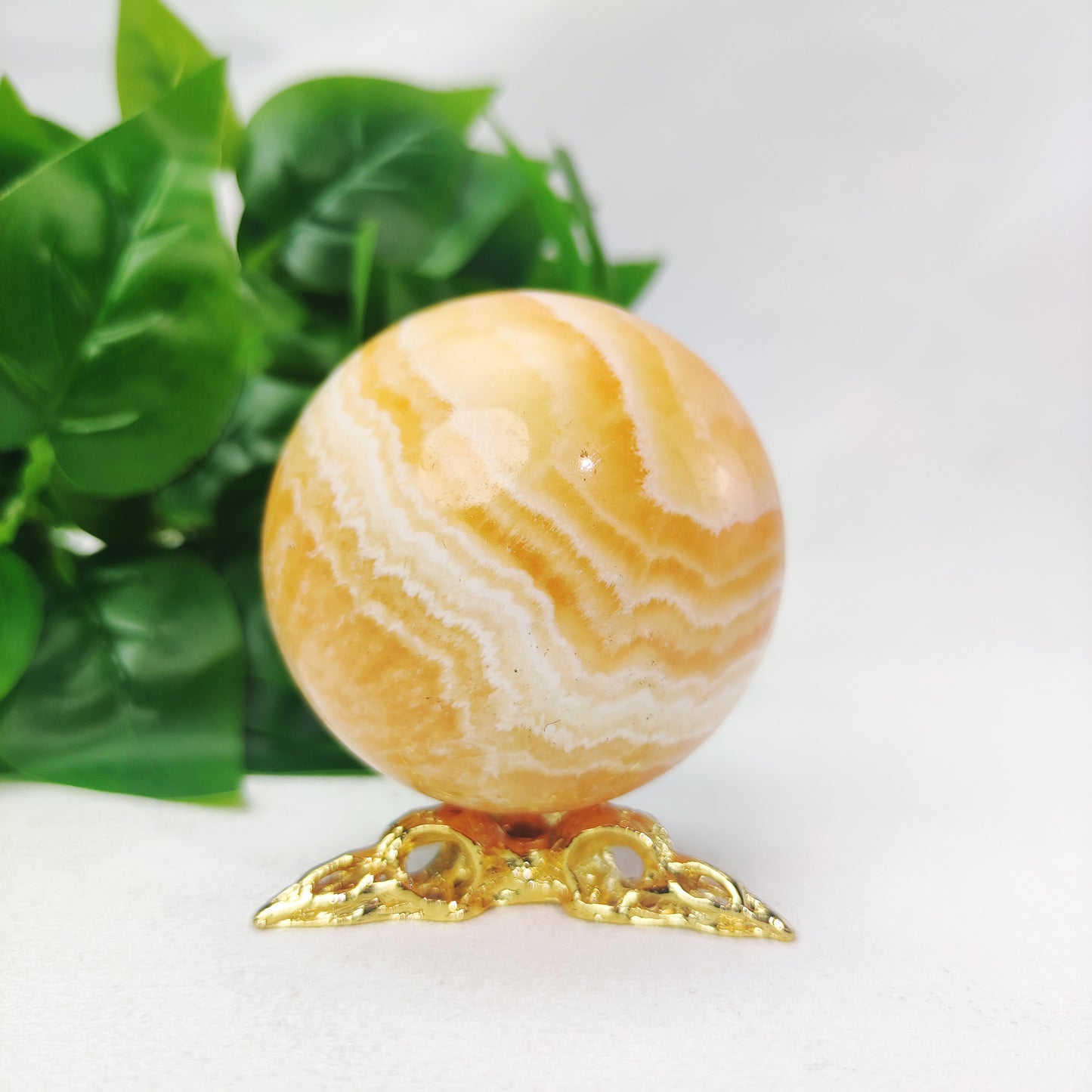 Yellow  Calcite Sphere with Raven Holder